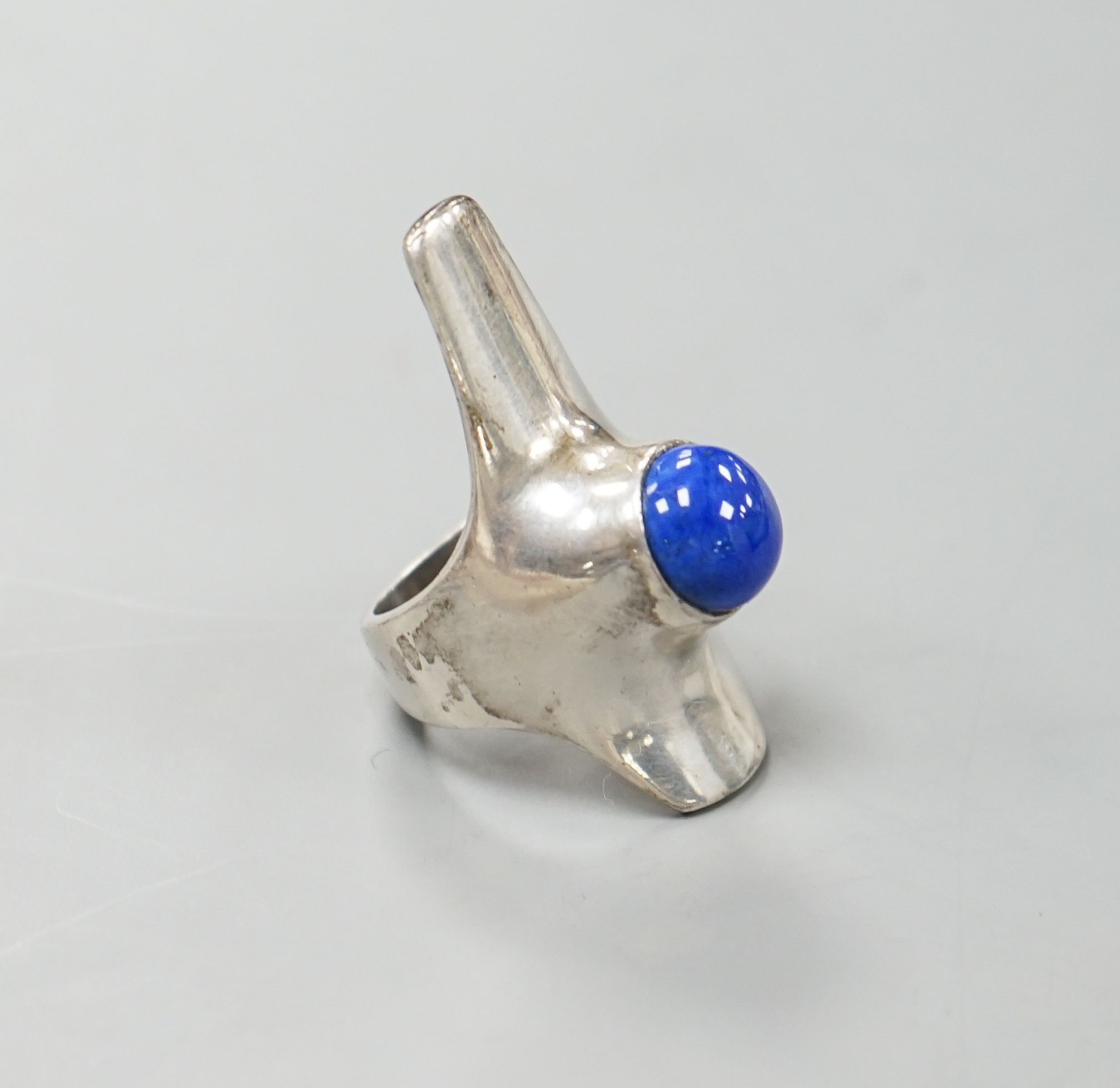 A Georg Jensen sterling and lapis lazuli set upfinger ring, no. 154, size K/L.